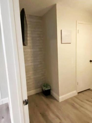 an empty room with a hallway with a door at 4 Bed 3 Bath House, Spacious, Smart TVs in all rooms, Whole house to yourself in Garland
