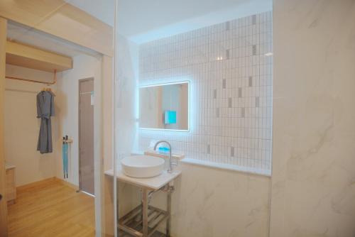 a bathroom with a sink and a mirror at Infinity Aonang Krabi in Ao Nang Beach