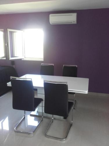 a meeting room with a white table and chairs at Apartments with parking space Rukavac, Vis - 8839 in Rukavac