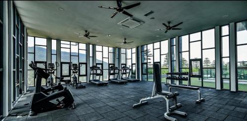 a gym with a bunch of exercise equipment in a building at LUXURIOUS AND COZY @GENTING VISTA 3B3B(FREE WI-FI) in Genting Highlands