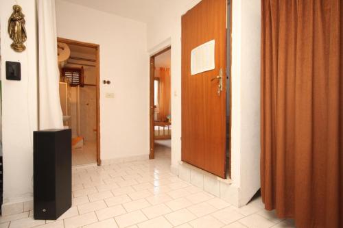 a hallway with a door to a room at Apartments with a parking space Rukavac, Vis - 8864 in Rukavac