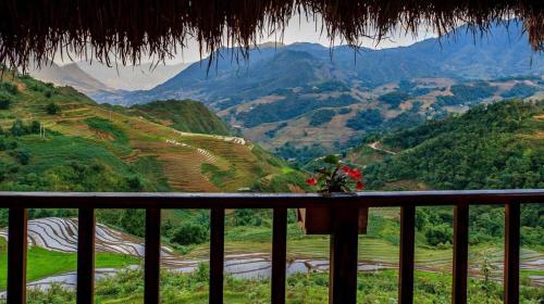 a balcony with a view of a valley and mountains at Sapa Rosie House in Sa Pa