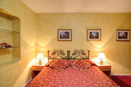 Un ou plusieurs lits dans un hébergement de l'établissement Monti Guest House - Affittacamere