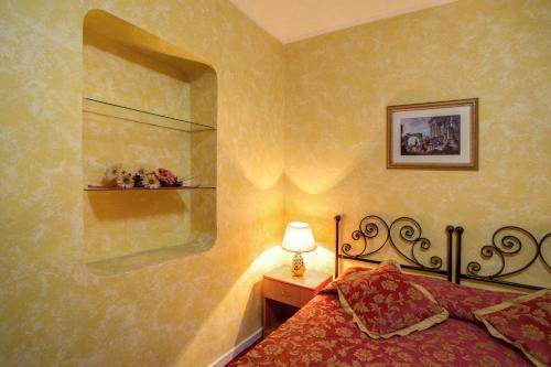 Un ou plusieurs lits dans un hébergement de l'établissement Monti Guest House - Affittacamere