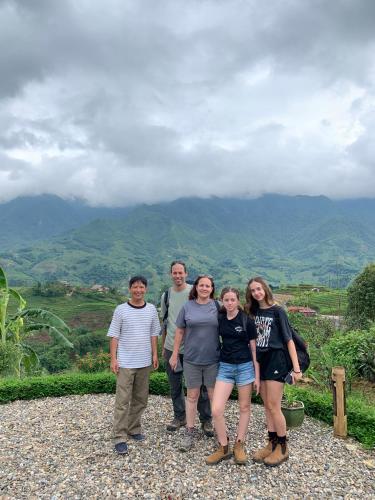 a group of people standing on top of a mountain at Sapa Rosie House in Sa Pa