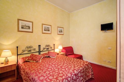 Un ou plusieurs lits dans un hébergement de l'établissement Monti Guest House - Affittacamere