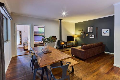 a living room with a table and a couch at RAC Margaret River Nature Park in Margaret River Town