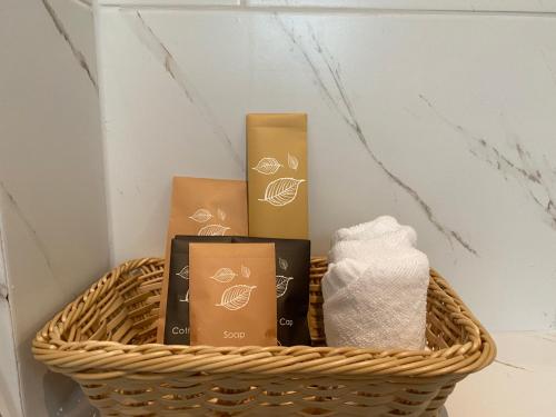 a basket with toiletries and towels in a room at Le Petit Saint Tropez in Khanom