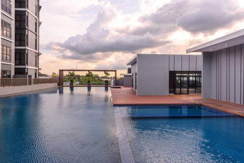 a swimming pool on the roof of a building at Pavilion Premier Suite Puchong - 6-7pax 3R2B in Puchong