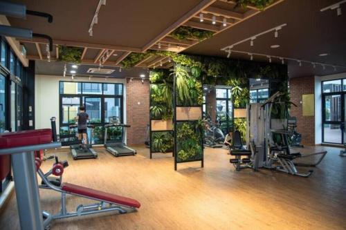 a gym with lots of plants on the walls at Pavilion Premier Suite Puchong - 6-7pax 3R2B in Puchong