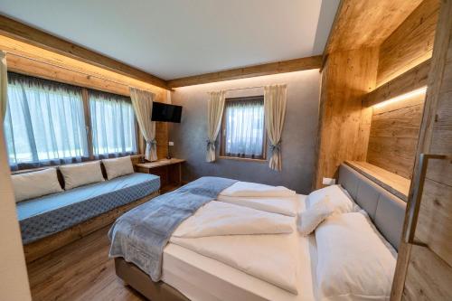 Postel nebo postele na pokoji v ubytování Hotel Siera Hof