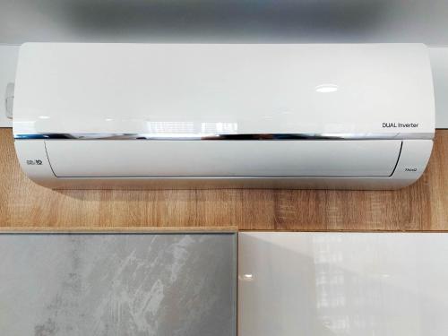 a white toaster oven sitting on top of a counter at Сучасні апартаменти в новобудові in Lviv
