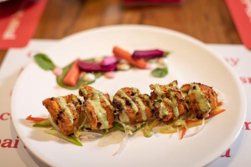 a plate of food with meat and vegetables on it at Ginger Mumbai, Goregaon in Mumbai