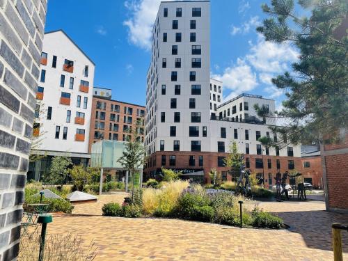 a group of tall buildings in a city at aday - Harbor Groundfloor Own Entrance - Studio in Aalborg