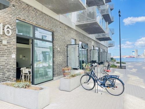 a bike parked on the side of a building at aday - Harbor Groundfloor Own Entrance - Studio in Aalborg