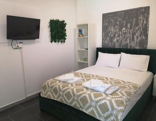 Katil atau katil-katil dalam bilik di Kalidonia “PANORAMA” STUDIO APARTMENT
