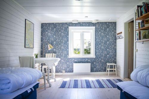 Säng eller sängar i ett rum på Bakgården i Revsund
