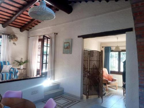 a living room with a couch and a mirror at Casa Carmen in Begur