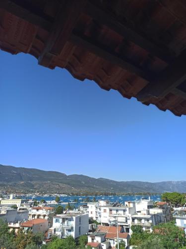 a view of a city from a window at Harmony in Poros