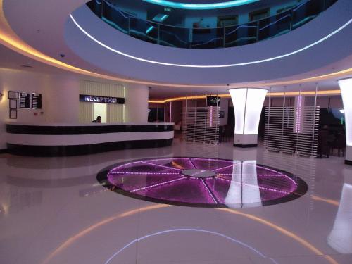 a lobby with a purple circle on the floor at Golden Palas Hotel in Cerkezkoy