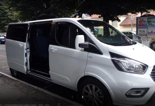 a white van parked on the side of a street at Villa Mirano Bed & Breakfast in Piossasco