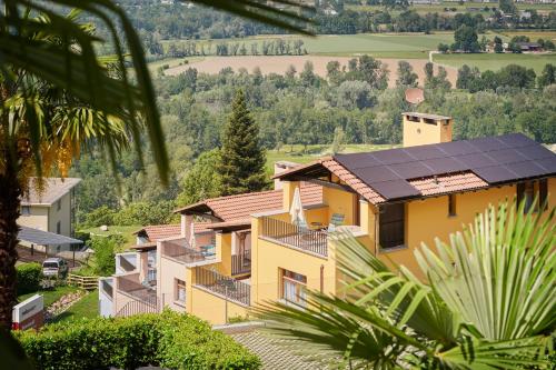 a group of houses with solar panels on their roofs at Reka-Ferienanlage Magadino in Magadino