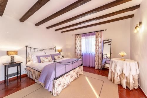 מיטה או מיטות בחדר ב-Villa Junceira