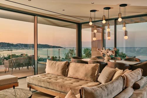 a living room with a couch and a view of the water at Althea Lavish Estate - Villa & Suite in Zakynthos Town