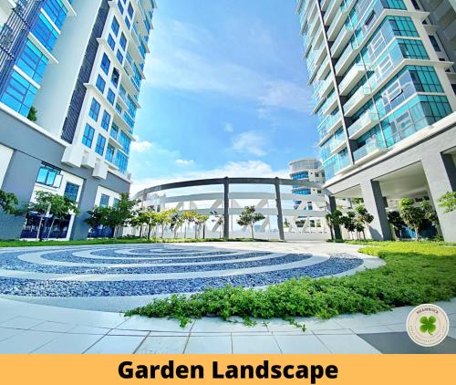 a garden landscape in front of a building at Pacific Tower Petaling Jaya By Shamrock in Petaling Jaya