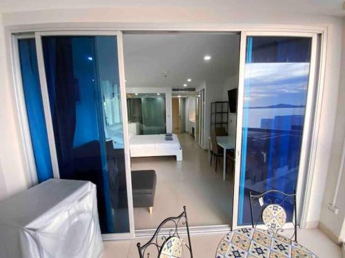 a large room with a view of a bedroom at Sands Condo Studio 14 by ThaiminatorPattaya in Pattaya South