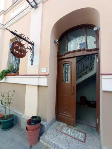 a door to a store with a sale sign next to it at La Maison #7 in Tbilisi City