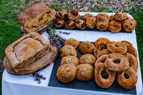a tray of bread and pastries on a table at Casas Campo Cimo da Quinta in Miranda do Douro