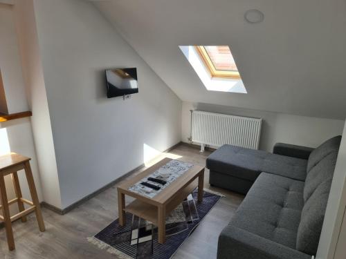 a living room with a couch and a table at Old Town apartments in Novi Sad