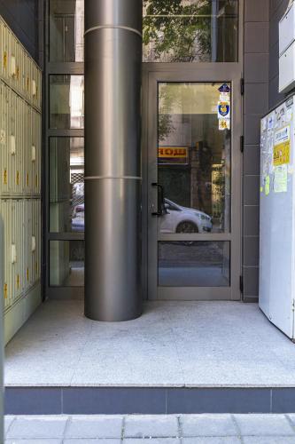 an entrance to a building with a revolving door at Stylish 2BD Apartment with a Nice Cozy Terrace by Flat Mаnager in Plovdiv