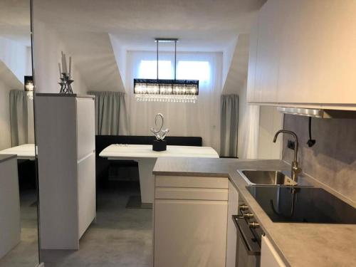 a kitchen with a sink and a counter top at Townville Chalet´s in Flachau