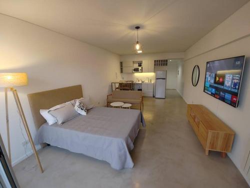 A bed or beds in a room at Lugar ideal con pileta , mucha vida alrededor