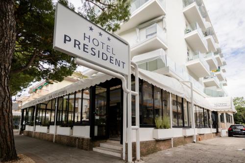 a hotel registration sign in front of a building at Hotel President in Lido di Jesolo