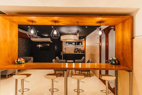 a dining room with a table and chairs at Hotel Hacienda Lima Norte in Lima