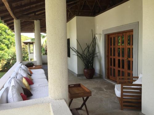 a living room with a couch and a table at Gecko Resort in Watamu