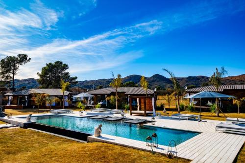 an image of a swimming pool at a resort at OMM Suites Resort, Villa General Belgrano in Villa General Belgrano