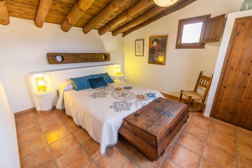 Een bed of bedden in een kamer bij Mas de L'Acordio