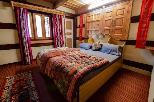 a bedroom with a bed in a room at Folktales Residency in Saturang