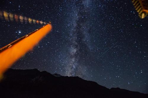a person is looking at the stars and the milky way at Folktales Residency in Saturang