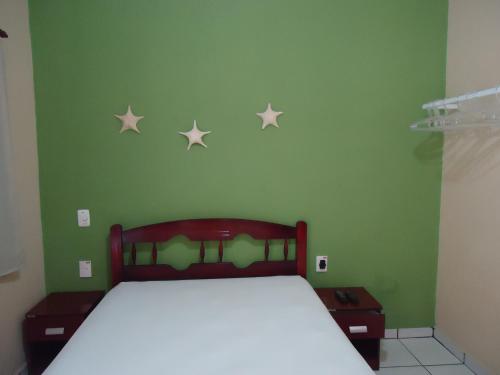 Ένα ή περισσότερα κρεβάτια σε δωμάτιο στο Pousada do Beto