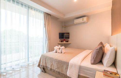 Katil atau katil-katil dalam bilik di Lada Krabi Residence Hotel - SHA Plus