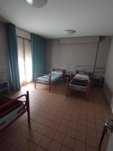 Postel nebo postele na pokoji v ubytování Ostello Torino