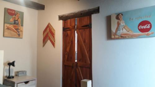 an open door in a room with a cocacola sign at StarFish Accommodation in Struisbaai