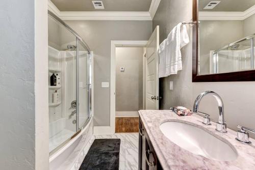 a bathroom with a sink and a shower at Boho Bungalow-walk to Plaza District can sleep 8 in Oklahoma City
