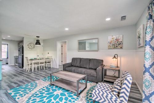 a living room with a couch and a table at 5 Mi to Branson Strip! Cozy Condo with Mtn Views in Branson