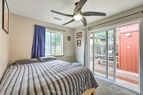 a bedroom with a bed and a ceiling fan at Forested Flagstaff Getaway with Garden and Gas Grill in Mountainaire